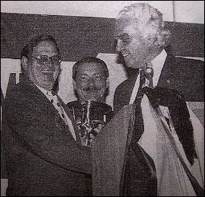 Dr. Holmberg receiving an Award from Dr. Williams. - Copyright – Stock Photo / Register Mark