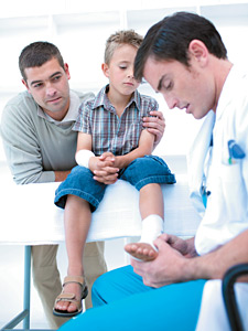 doctor examining feet - Copyright – Stock Photo / Register Mark